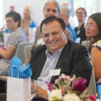 faculty laughing and smiling